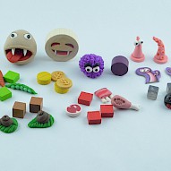 handmade tokens next to original tokens from the game