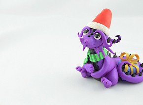 Christmas dragon with gift