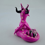 pink dragon with a gem