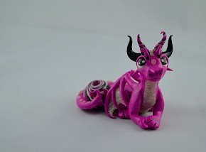 pink dragon with a gem