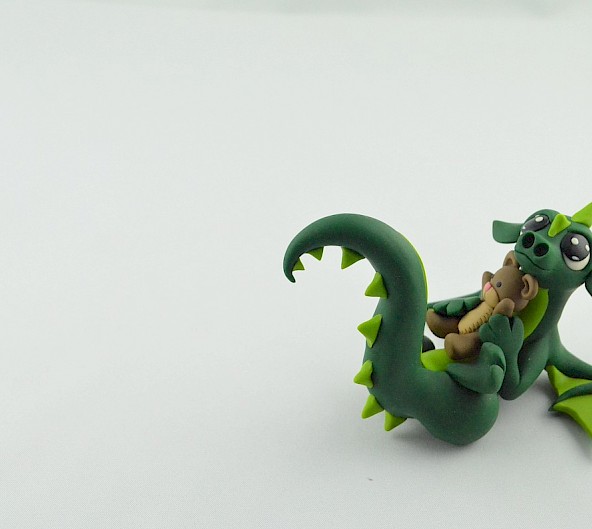 dragon with a teddy bear
